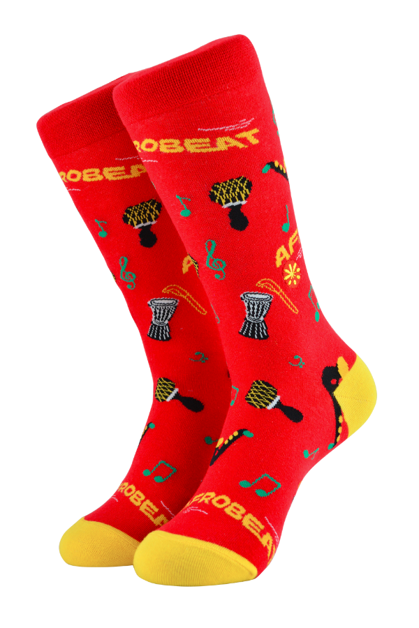 Afrobeat socks is a celebration of Afrobeat. The West African music genre was pioneered in the 1960s by Nigerian artist, Fela Kuti. It is a mixture of traditional Yoruba music such as fuji and other contemporary sounds of the time, like jazz and soul.
Instruments on socks: shekere, djembe drum, talking drum, saxophone