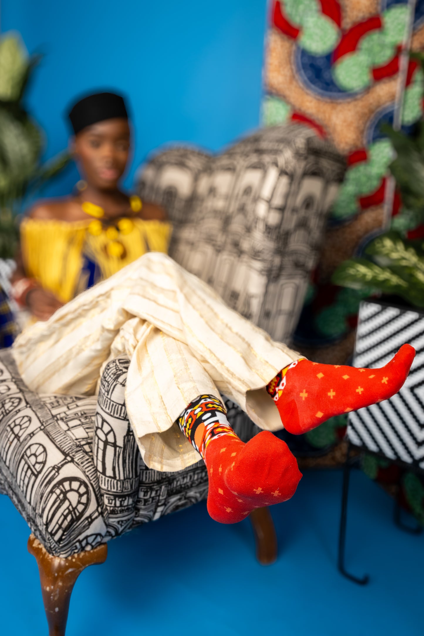 This design is inspired by the traditional Angolan textile print, called the “Samakaka”. There is little to no information as to the symbology of the fabric. However, the original print features colors from the Angolan flag but as time passed, additional colors were introduced. Red represents the blood shed by the people who fought for the anti colonization movement. The black represents the land or the African continent. The yellow or gold represents the country’s wealth.
