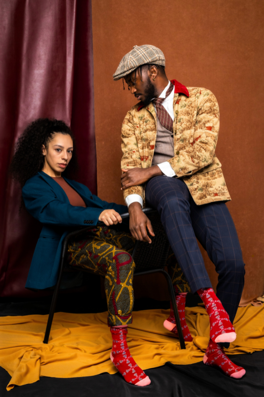 Burgundy socks. In Yoruba, the translation for hand fan is Abębę (pronounced Ah-beh-beh). Hand fans are mostly seen being held by brides during the Yoruba traditional wedding ceremony. For us, this is a symbol of love and unity between spouses.