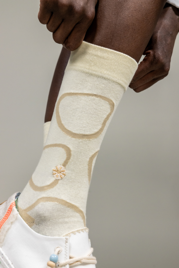 Cream socks. The Twiga socks is an alternative design of the giraffe pattern. The Swahili word for giraffe is twiga. Giraffe's are a common sight across Africa savannah's, from East to Southern Africa.